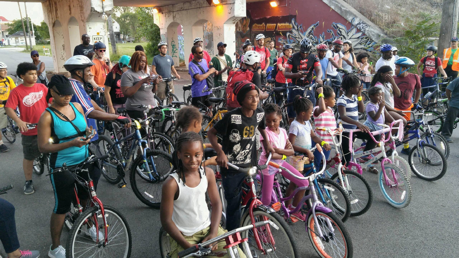 group of people with bikes waiting for bike ride to begin