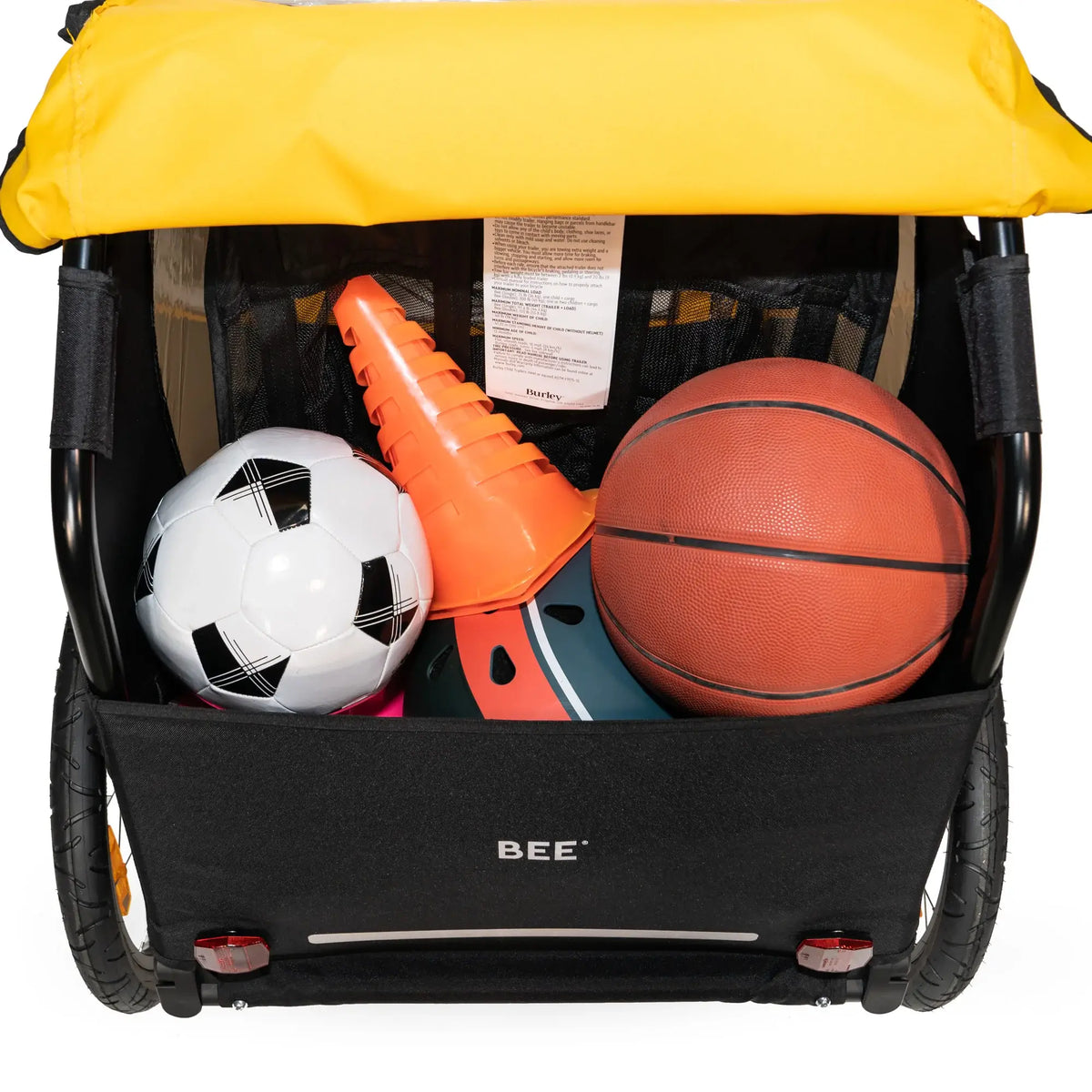 Bee Double cargo area filled with sports equipment.