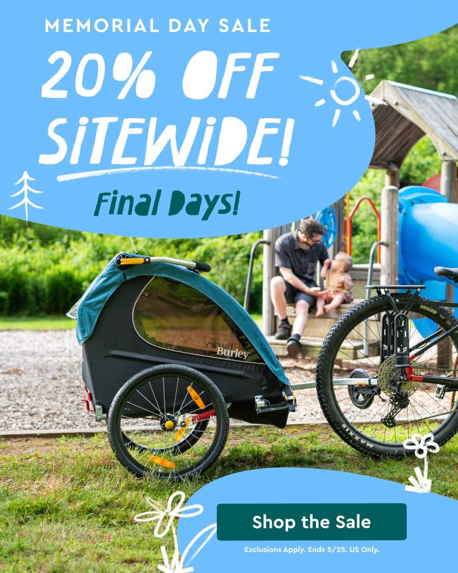 "Memorial Day Sale: 20% Off Sitewide, Final Days!" written on photo of bicycle with trailer and playground in the background.