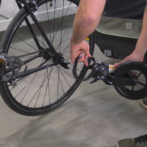 Video demonstrating D'Lite X Kid Bike Trailer hitching, strolling and folding functionality.