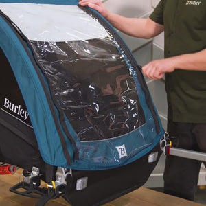 Video demonstrating Encore X Kid Bike Trailer weatherized cover, handlebar and brake functionality.