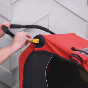 Video demonstrating Honey Bee Kid Bike Trailer handlebar, brake, cover and seating functionality.