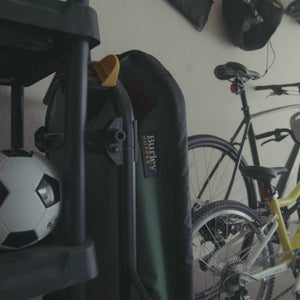 Video of Hopper Bike Trailer Wagon setup and loading sports equipment then cycling with child to park. Then trailer is transitioned to stroller mode to carry gear to field.