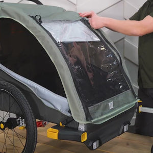 Video demonstrating Honey Bee Kid Bike Trailer handlebar, brake and weatherized cover functionality.
